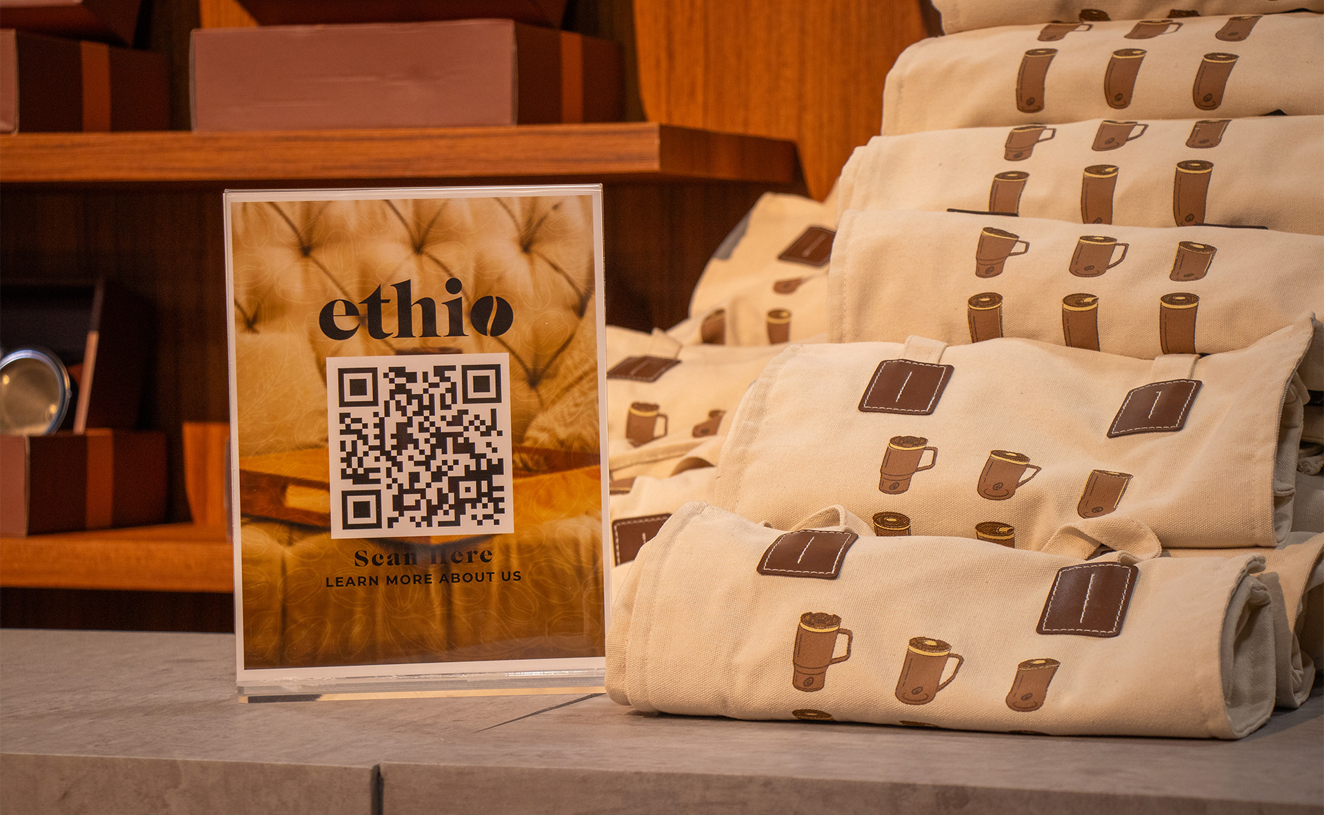 An Ethio QR code poster and tote bags.